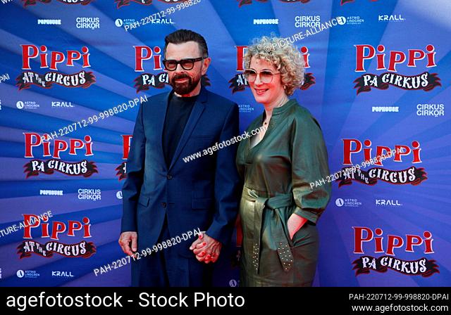 12 July 2022, Sweden, Stockholm: Abba star Björn Ulvaeus arrives with his partner Christina Sas for the premiere of the circus musical he produced