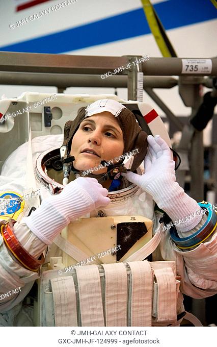 European Space Agency astronaut Samantha Cristoforetti, Expedition 4243 flight engineer, makes final touches on a training version of her Extravehicular...