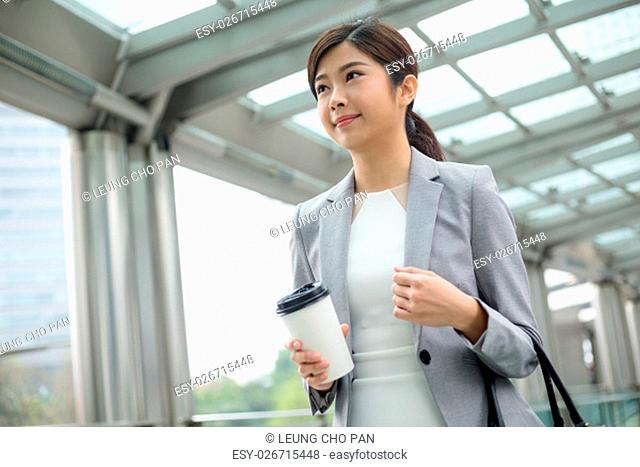 Businesswoman walking outside