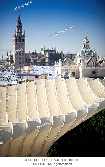 The Giralda tower left and El Salvador dome right as seen from the top of Metropol Parasol foreground, Seville, Spain