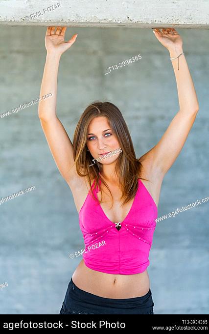 Teenage girl raised arms