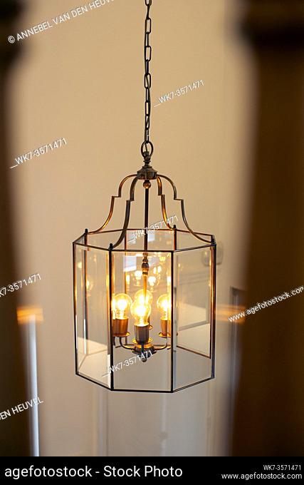 Chrystal chandelier close-up, light decor with light bulbs modern design beautiful home decoration beauty
