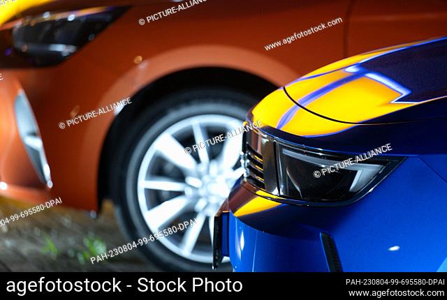 04 August 2023, Saxony-Anhalt, Wittenberg: New cars stand on the premises of an Opel dealership in Wittenberg. The Federal Motor Transport Authority publishes...