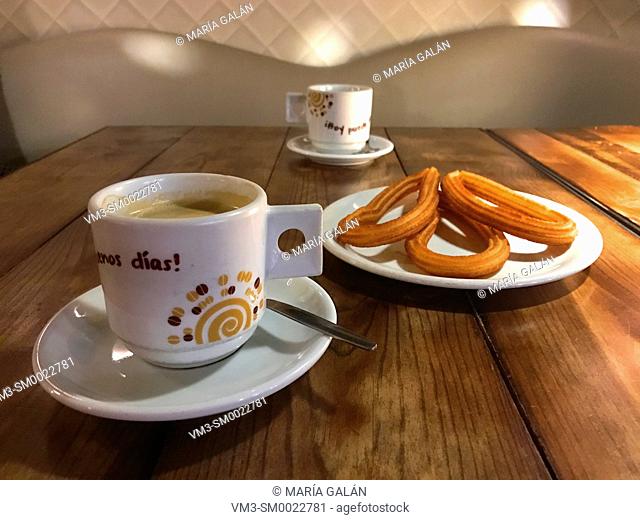 Two cups of coffee with churros for breakfast. Madrid, Spain