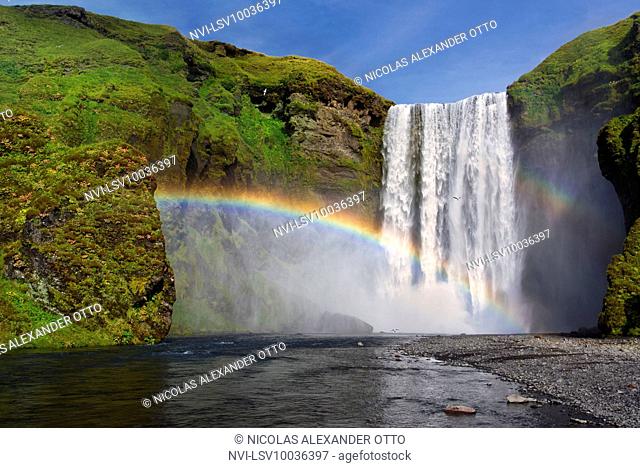 Skogafoss waterfall in the sunshine with rainbow, Skogar, Iceland