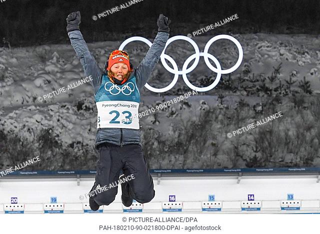 Germany's Laura Dahlmeier celebrates her victory on the podium of the the women's biathlon 7.5km sprint in the Alpenisa centre in Pyeongchang, South Korea