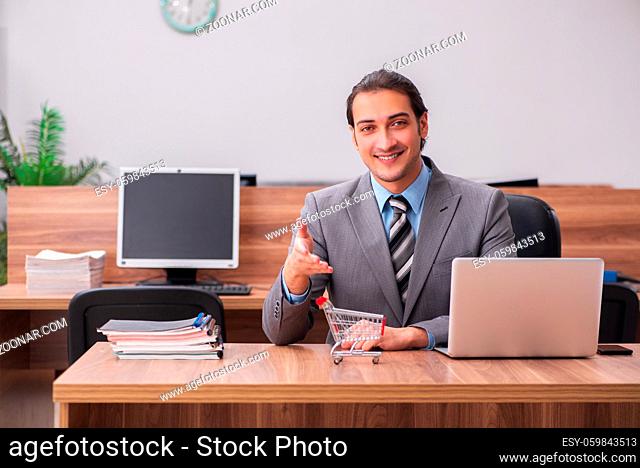 Young businessman employee in ecommerce concept