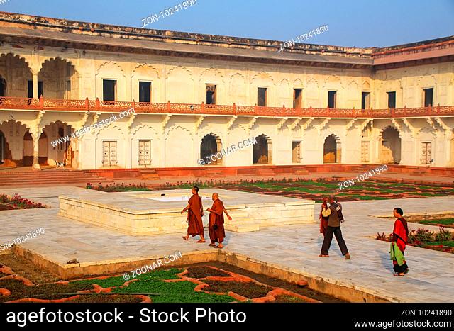 Visitors walking around Anguri Bagh (Grape Garden) in Agra Fort, Uttar Pradesh, India. The fort was built primarily as a military structure