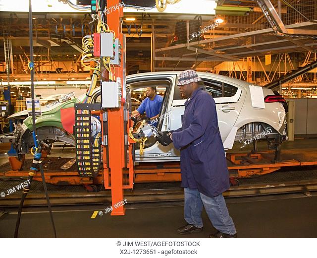 Detroit, Michigan - Workers install the instrument panel in the Chevrolet Volt at General Motors' Detroit-Hamtramck Assembly Plant  The Volt is powered by...