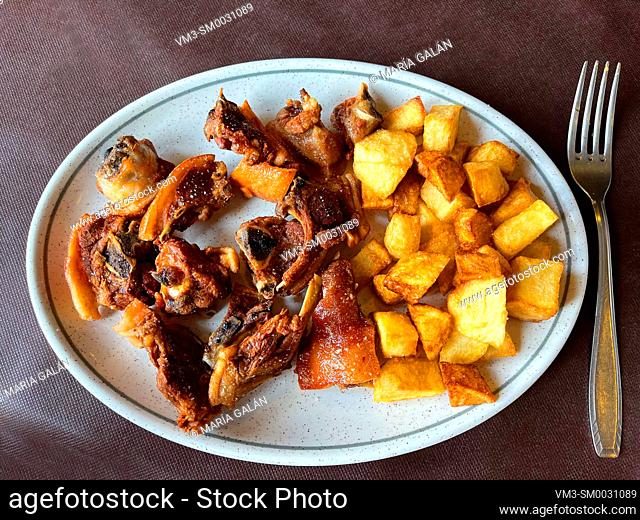 Cochifrito, fried pork meat with potatoes. Spain