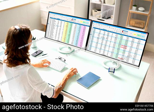 Data Analyst Woman Using Spreadsheet On Computer