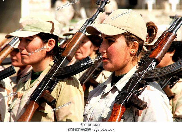 Peshmerga women fighters with machine guns during military exercise, Iraq, Iraqi Kurdistan, Sulaimaniyya, Sulaymaniyah