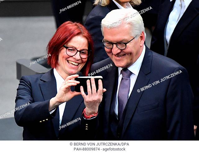 An employee of the German parliament takes a selfie with the designated Federal president Frank-Walter Steinmeier at the German parliament in Berlin, Germany