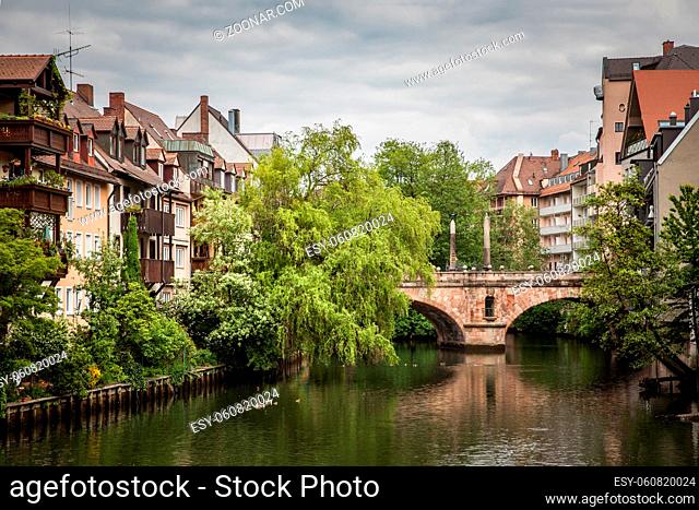 Old town of Nuremberg, Germany. Houses and trees by Pegnitz river. German citycape