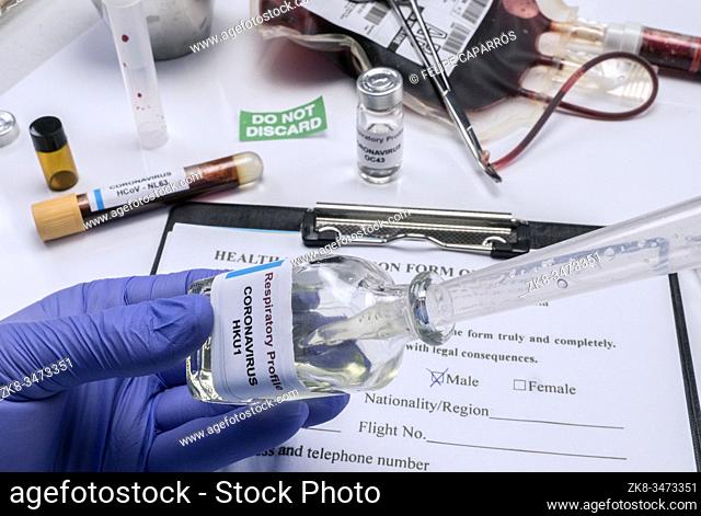 Scientist examines sample of coronavirus in laboratory, conceptual image