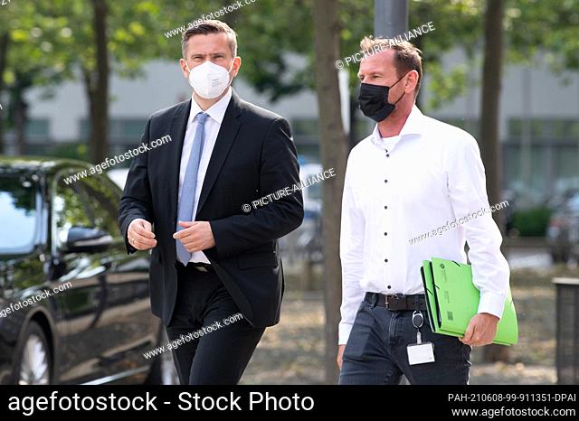 08 June 2021, Saxony, Dresden: Martin Dulig (SPD, l), Saxony's Minister of Economic Affairs, arrives at the Saxon State Parliament for a press statement...