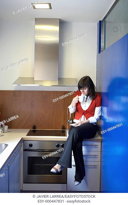 Young girl in rural hotel, kitchen