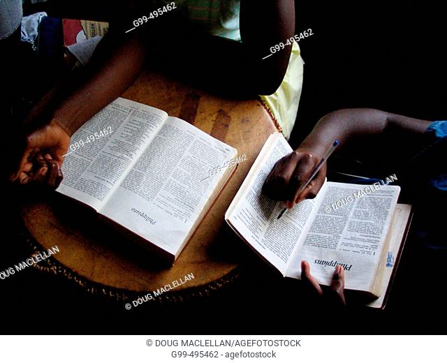 Children at the Kampala School for the Physically Handicapped, Uganda read bibles during Sunday school