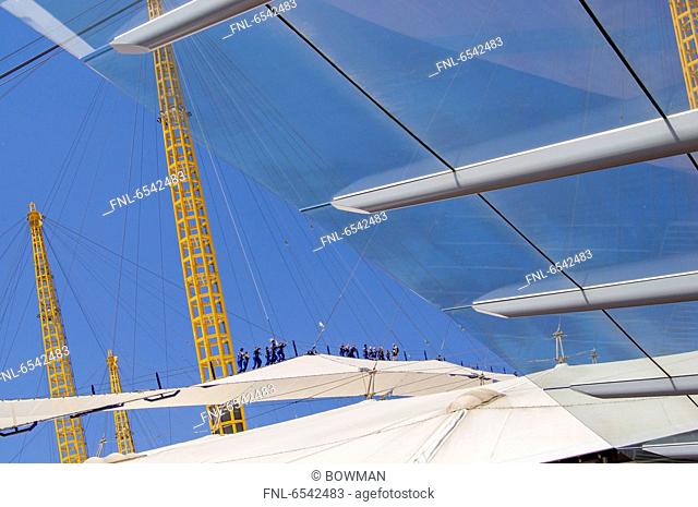 Tourists climbing on roof of Millennium dome, Greenwich, London, England, Great Britain, Europe