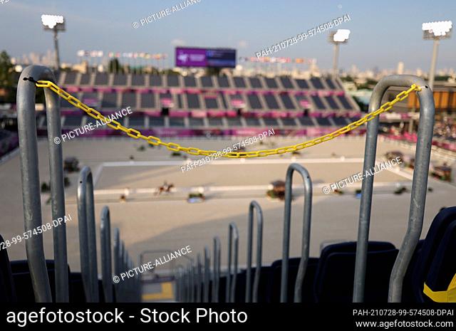 28 July 2021, Japan, Tokio: Equestrian sport/dressage: Olympics, individual, final at the Equestrian Park. The stands are cordoned off