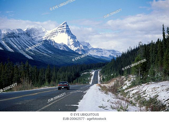 Car on Trans-Canada highway through snow covered landscape