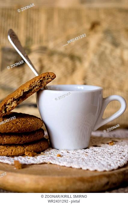 Oat cookies biscuits with cup of coffee