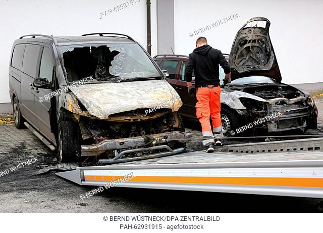 Burnt-out cars can be seen in the parking lot of a shopping center in Stralsund, Germany, 24 October 2015. The cars were set on fire on the evening of 23...