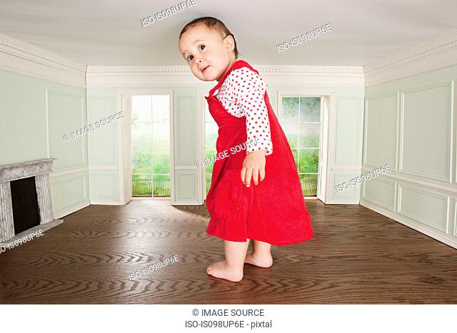 Big toddler girl in a tiny room