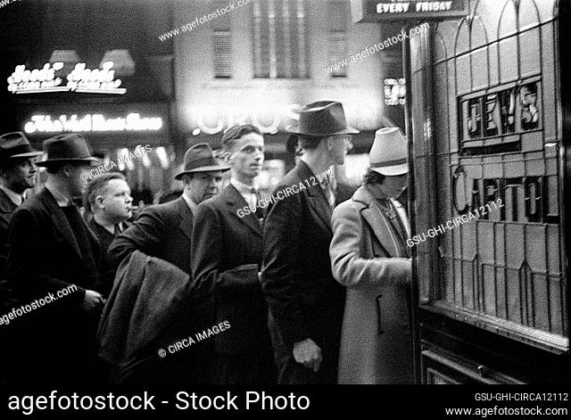 Street scene with people waiting in line for tickets outside Loew's Capitol motion picture theatre, Washington, D.C., USA, David Myers, U.S