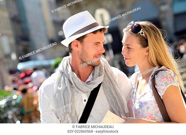 Young couple visiting city in summertime