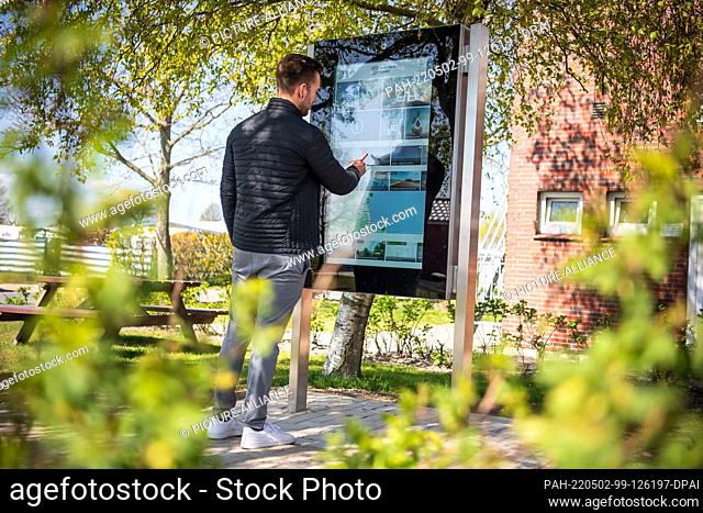 02 May 2022, Lower Saxony, Wangerland: An info monitor of the digital visitor management system. The aim of the system is to use sensors to measure the...
