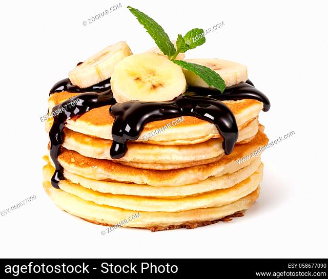 Pancakes with banana and syrup Isolated on white background