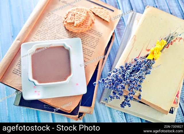 cocoa and books on the wooden table
