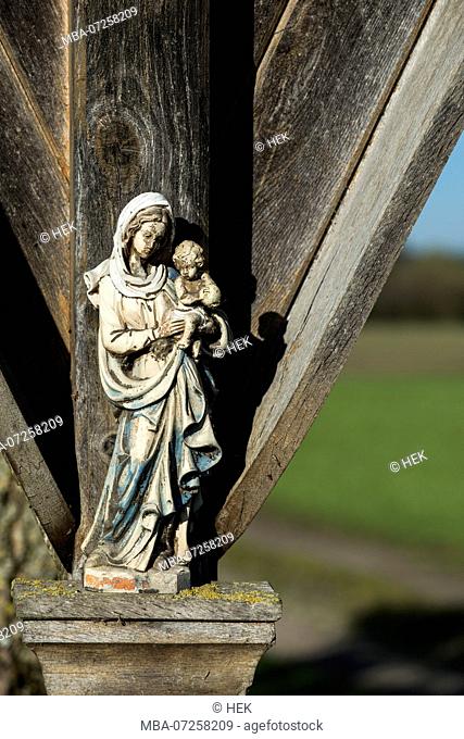 weathered Virgin Mary figure with child at a wayside cross, Upper Bavaria, Bavaria, Germany, Europe