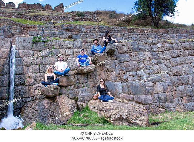 Travellers at Tipùn, located east of Cusco, are Inca ruins, Peru