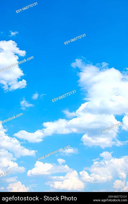 Clouds in the blue sky. Vertical background