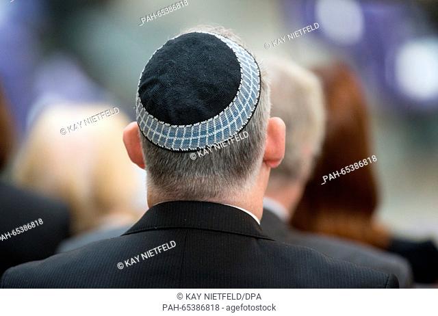 A spectator wearing a yarmulke takes part in a memorial event for the victims of National Socialism in the Bundestag in Berlin,  Germany, 27 January 2016