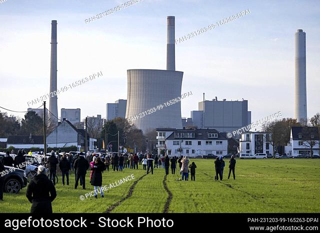 03 December 2023, North Rhine-Westphalia, Voerde: View of the leaning 165-metre-high cooling tower of the RWE coal-fired power plant