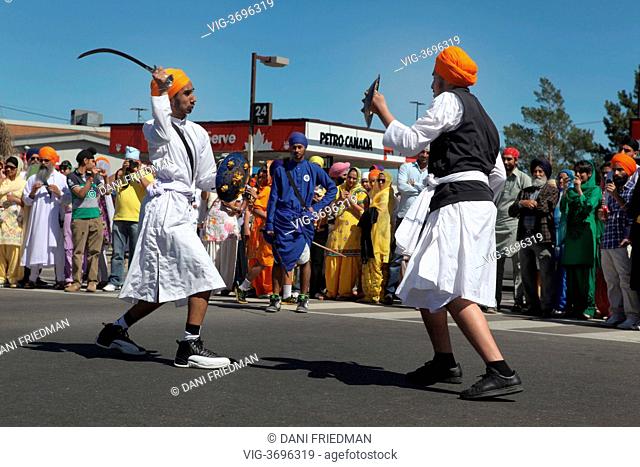 CANADA, MALTON, 05.05.2013, Sikh youth spar during a gatka (Sikh martial arts) performance at a Nagar Kirtan celebrating Vaisakhi in Malton, Ontario, Canada