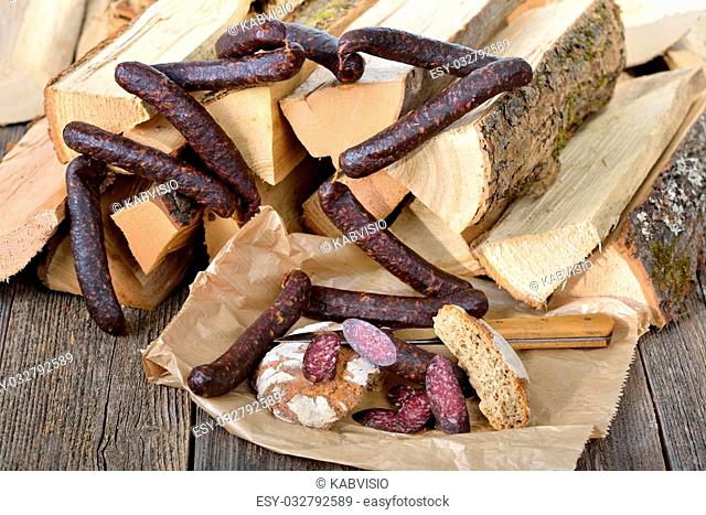 Typical snack from South Tyrol: dark smoked and air dried sausages with rye flat bread, so-called ""Kaminwurzen"" and ""Vinschgerl"""""