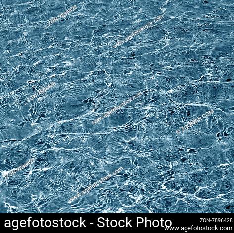 Transparent water in ocean. Blue abstract background