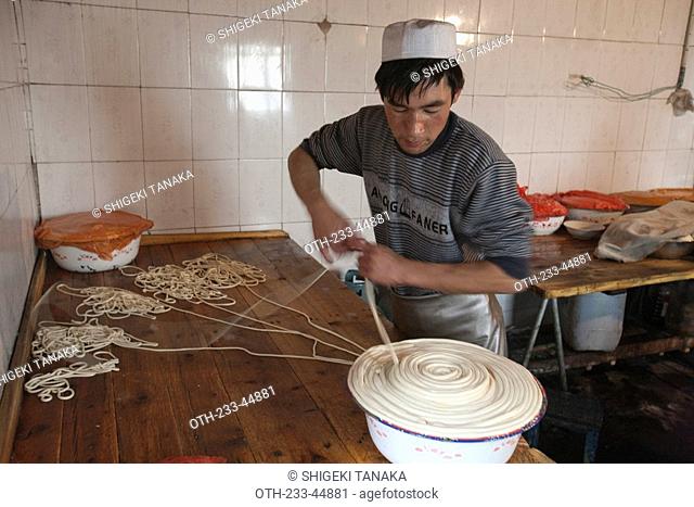 Lagman making Uyghur noodle, Turpan, Xinjiang, China