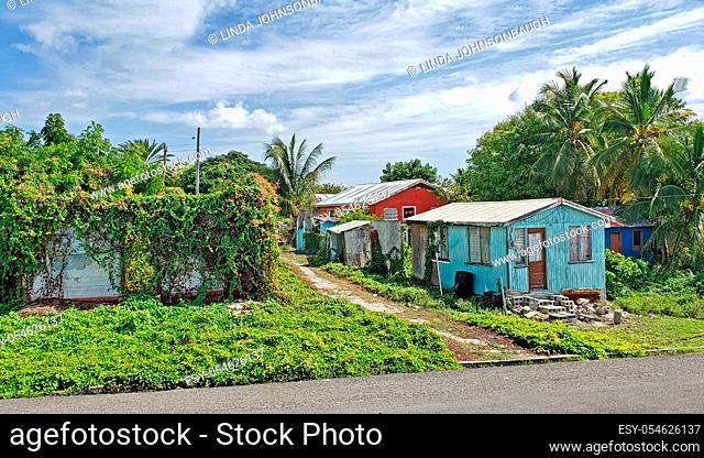 Three colorful typical homes in Antigua Barbuda Lesser Antilles, West Indies, Caribbean