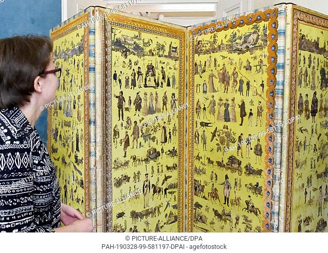28 March 2019, Brandenburg, Paaretz: A Paravan from around 1805, decorated with painted and cut-out copper engravings, etchings and picture originals