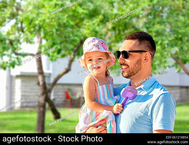 happy father with little daughter in garden