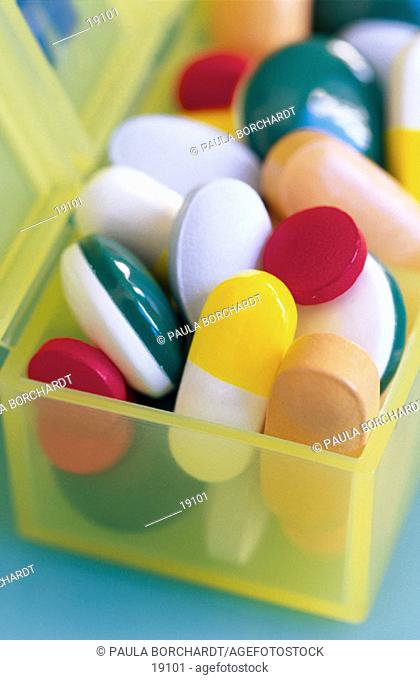 Multicolored pills in pill case