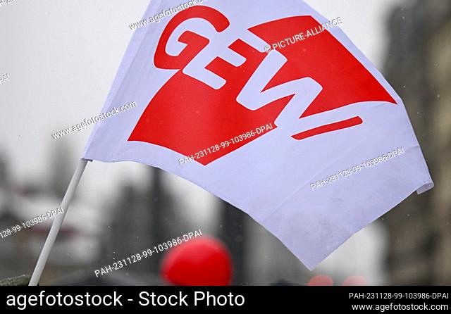 28 November 2023, Saxony, Leipzig: An Education and Science Union flag flies at a warning strike by employed teachers. The GEW union wants to use the nationwide...