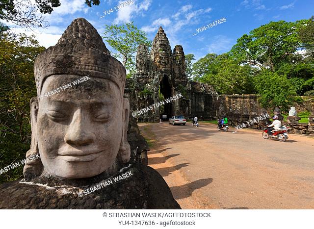 Stone sculptures border the bridge to the temple Angkor Thom in Angkor  Cambodia  Asia