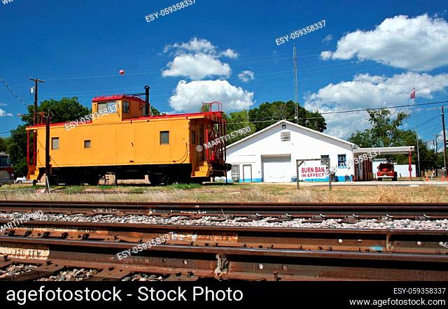 Buildings in Small Town Caboose at Railroad With Fire Station. Rural Texas