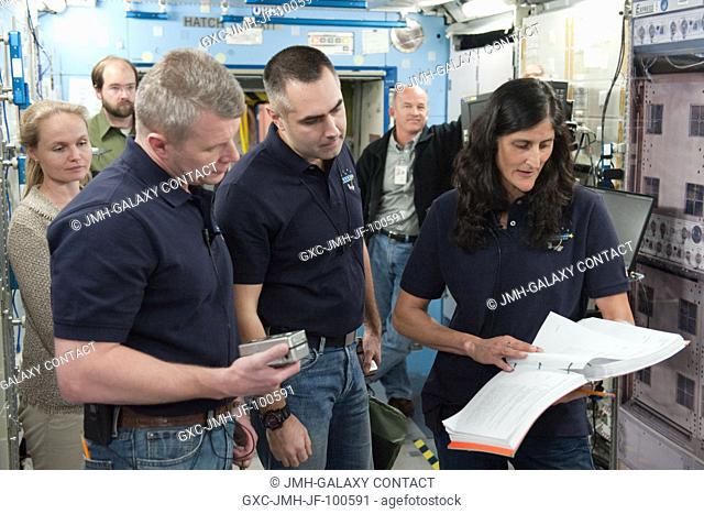 NASA astronaut Sunita Williams, Expedition 32 flight engineer and Expedition 33 commander; along with Russian cosmonauts Evgeny Tarelkin (center) and Oleg...